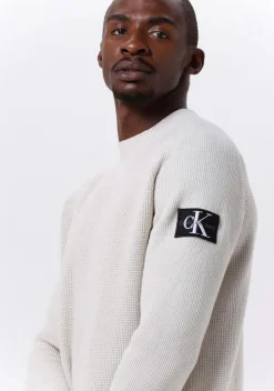 beige calvin klein sweater monologo badge sweater