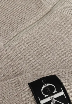 beige calvin klein trui badge plated half zip sweater