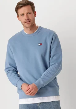 blauwe tommy jeans sweater tjm reg badge crew ext