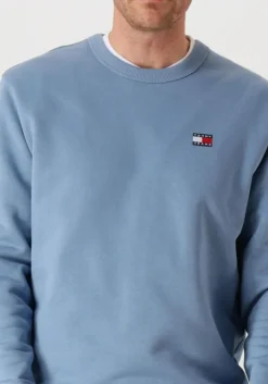 blauwe tommy jeans sweater tjm reg badge crew ext