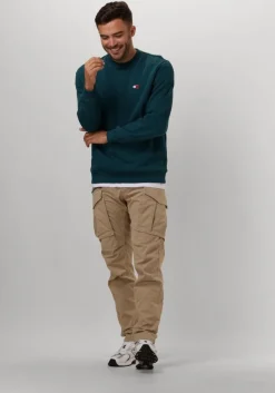 blauwe tommy jeans sweater tjm reg badge crew ext