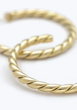 goudkleurig notre-v oorbellen x florine - bailar hoops