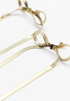 goudkleurig notre-v oorbellen earring bow