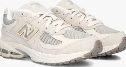 grijze new balance lage sneakers pc2002