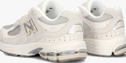 grijze new balance lage sneakers pc2002