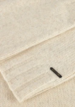 witte dstrezzed coltrui ove turtleneck