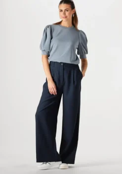 witte maruti lage sneakers momo